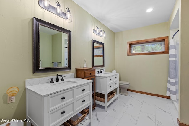 full bath featuring baseboards, toilet, a sink, marble finish floor, and two vanities