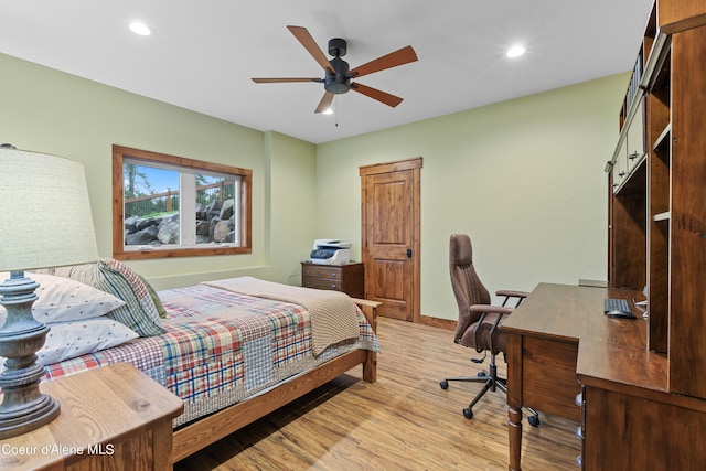 bedroom with light wood finished floors, baseboards, a ceiling fan, and recessed lighting