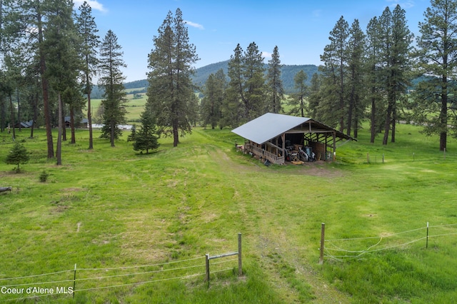 birds eye view of property with a rural view and a mountain view