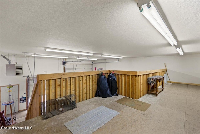 basement featuring a textured ceiling