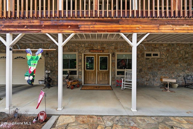 doorway to property with stone siding