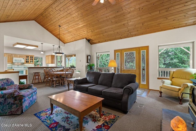 living room featuring high vaulted ceiling, wooden ceiling, carpet flooring, and a healthy amount of sunlight