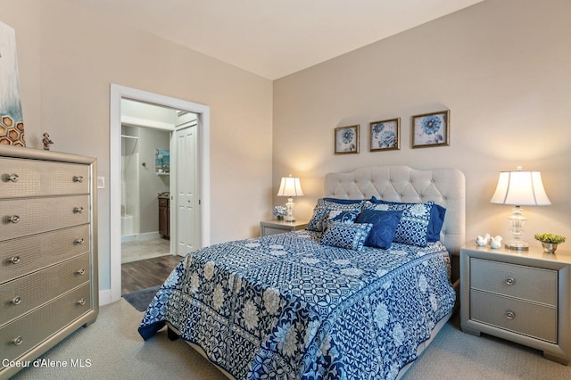 bedroom featuring carpet flooring, connected bathroom, and baseboards