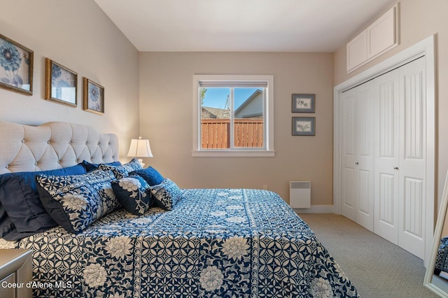 carpeted bedroom with a closet