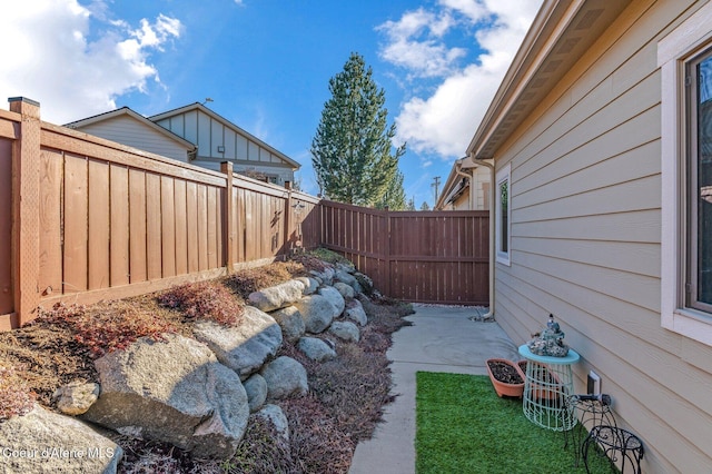 view of yard with a patio area and a fenced backyard