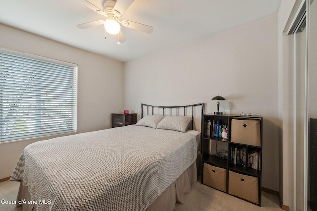 bedroom featuring carpet flooring, a ceiling fan, and baseboards