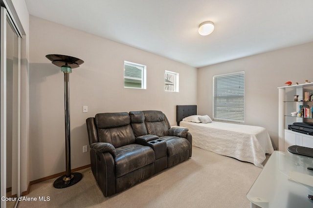 carpeted bedroom with baseboards