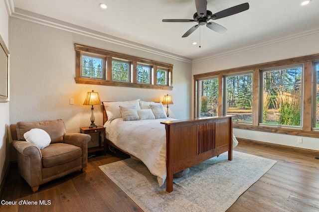 bedroom with ornamental molding, hardwood / wood-style flooring, and recessed lighting