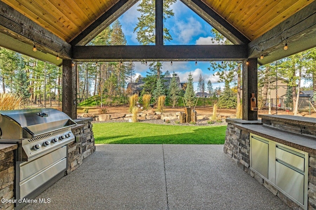 view of patio with exterior kitchen and grilling area