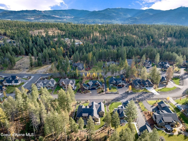 bird's eye view featuring a residential view, a mountain view, and a forest view