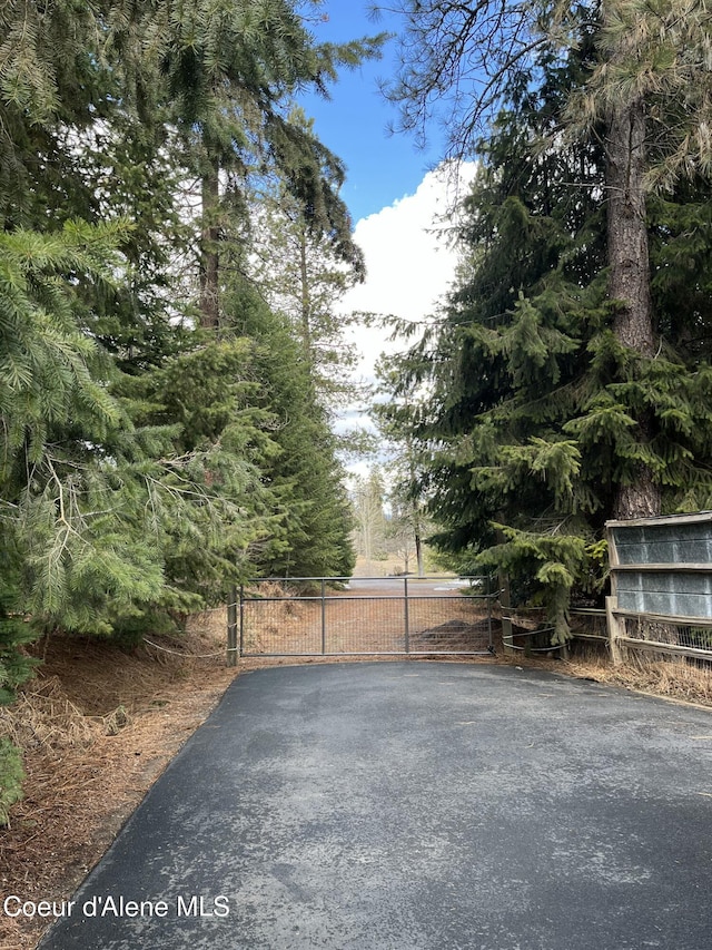 view of gate with fence