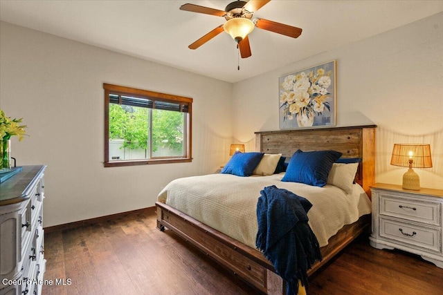 6489 E Kyong, Post Falls, ID 83854 - bedroom featuring dark wood finished floors, baseboards, and a ceiling fan
