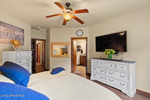 6489 E Kyong, Post Falls, ID 83854 - bedroom with connected bathroom, a ceiling fan, and baseboards
