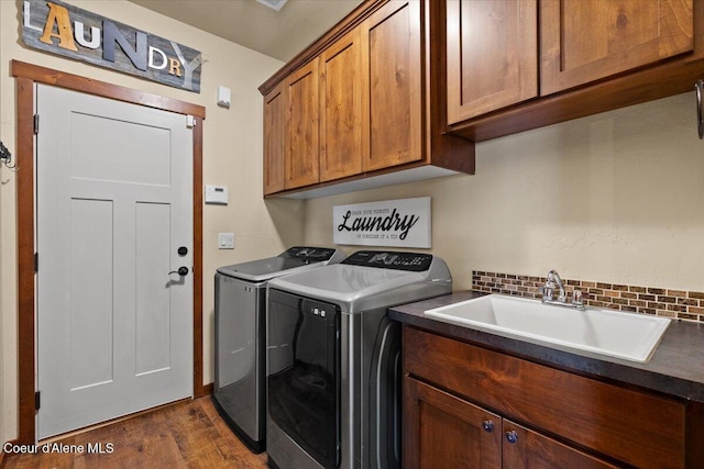 6489 E Kyong, Post Falls, ID 83854 - laundry room featuring cabinet space, washer and clothes dryer, and dark wood-style floors
