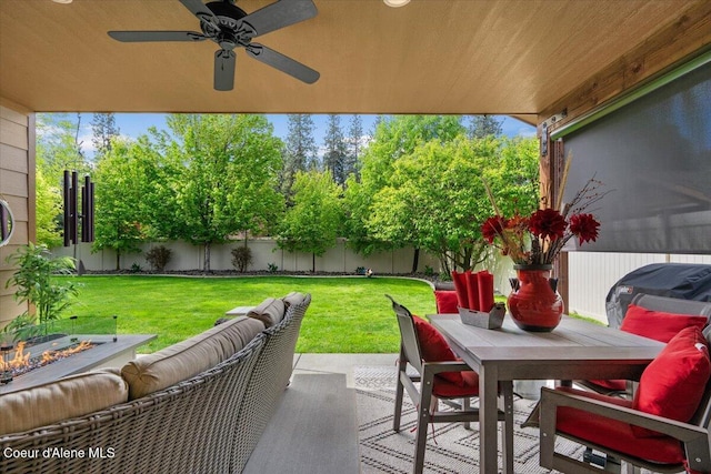 6489 E Kyong, Post Falls, ID 83854 - view of patio / terrace featuring outdoor dining space, an outdoor hangout area, and ceiling fan