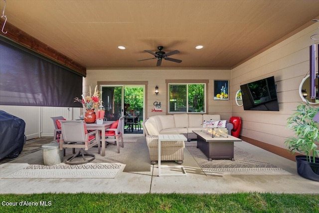 6489 E Kyong, Post Falls, ID 83854 - view of patio / terrace with a ceiling fan, an outdoor living space with a fire pit, outdoor dining area, and area for grilling