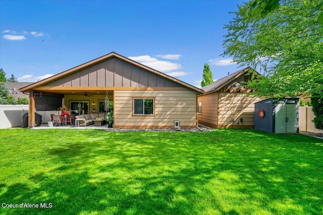 6489 E Kyong, Post Falls, ID 83854 - rear view of property featuring outdoor lounge area, a ceiling fan, and a patio