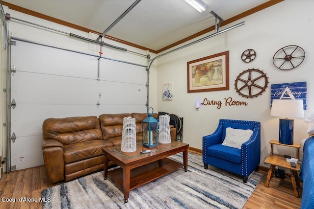 6489 E Kyong, Post Falls, ID 83854 - living area featuring wood finished floors, ornamental molding, and a garage