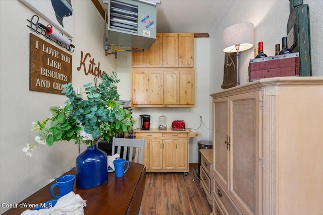6489 E Kyong, Post Falls, ID 83854 - kitchen featuring dark wood finished floors, a heating unit, light brown cabinetry, and light countertops