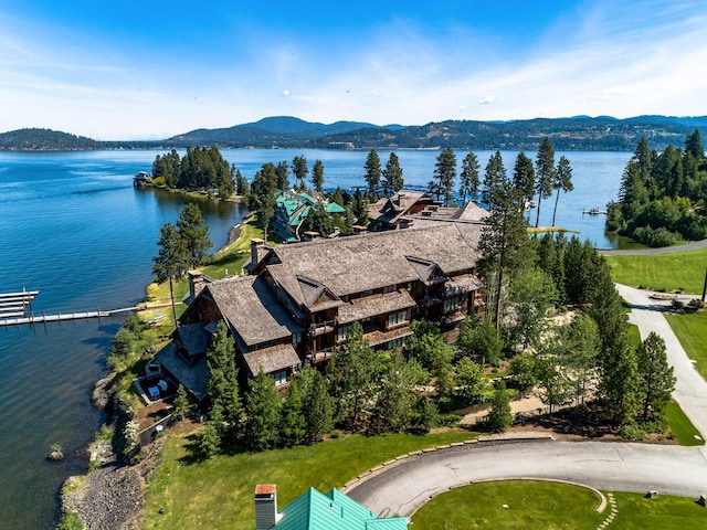 drone / aerial view featuring a water and mountain view