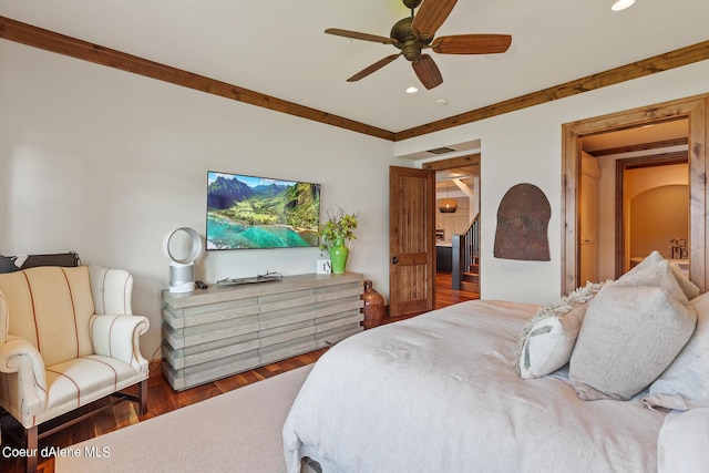 bedroom featuring crown molding, a ceiling fan, wood finished floors, and recessed lighting