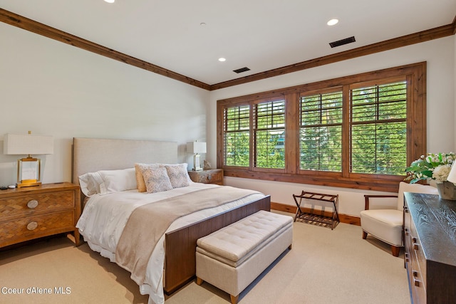 carpeted bedroom featuring baseboards, visible vents, crown molding, and recessed lighting