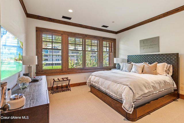 bedroom featuring multiple windows, visible vents, carpet flooring, and ornamental molding