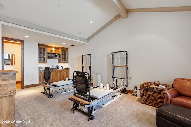 exercise area with recessed lighting, light colored carpet, visible vents, wet bar, and baseboards