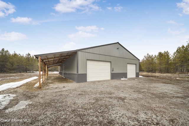 garage featuring a garage and driveway