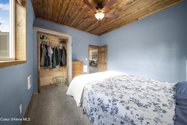 bedroom featuring a closet, carpet flooring, wood ceiling, and ceiling fan