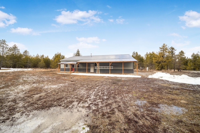 view of front of house featuring a porch and metal roof