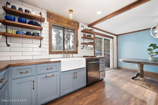 kitchen with open shelves, wood counters, a sink, stainless steel dishwasher, and backsplash