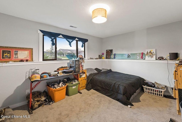 bedroom featuring visible vents and carpet floors