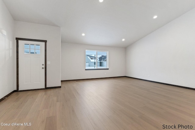 entrance foyer featuring light wood-style floors, recessed lighting, and baseboards