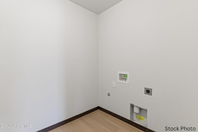 washroom featuring laundry area, baseboards, hookup for a washing machine, light wood-style floors, and electric dryer hookup