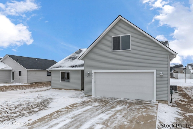 view of front of home featuring a garage and concrete driveway