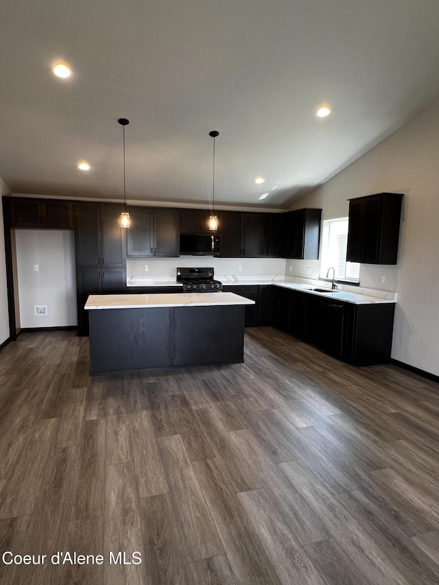 11557 N Railway Ave, Rathdrum, ID 83858 - kitchen with stainless steel microwave, gas range, light countertops, a center island, and vaulted ceiling