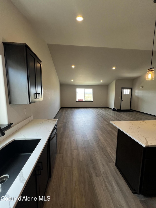 11557 N Railway Ave, Rathdrum, ID 83858 - kitchen with dishwasher, dark cabinetry, wood finished floors, light stone counters, and recessed lighting
