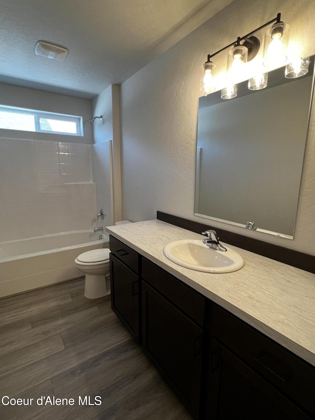11557 N Railway Ave, Rathdrum, ID 83858 - full bath featuring vanity, shower / washtub combination, wood finished floors, and a textured wall