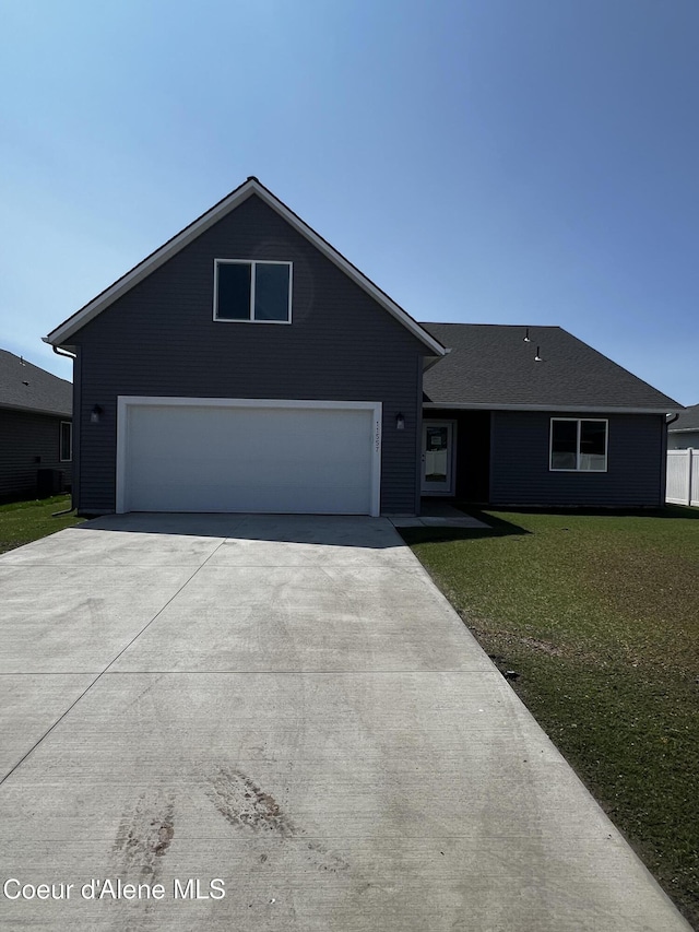 11557 N Railway Ave, Rathdrum, ID 83858 - view of front of home featuring driveway and a front lawn