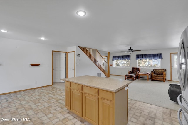 kitchen featuring light brown cabinetry, plenty of natural light, light countertops, and recessed lighting