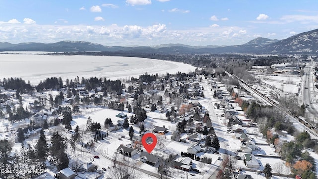 bird's eye view with a water and mountain view