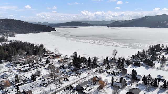 snowy aerial view with a mountain view