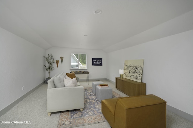 4550 E Savea Ln, Post Falls, ID 83854 - carpeted living room with vaulted ceiling and baseboards