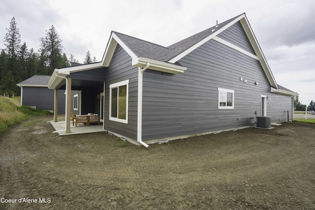4550 E Savea Ln, Post Falls, ID 83854 - view of property exterior featuring a patio and roof with shingles
