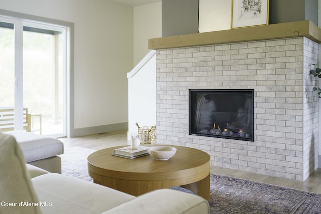 4550 E Savea Ln, Post Falls, ID 83854 - living room featuring wood finished floors and a fireplace
