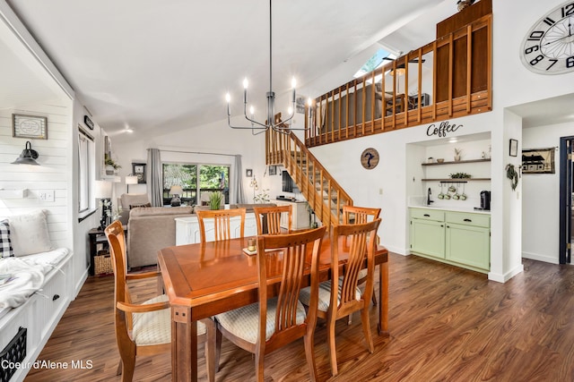 dining room with high vaulted ceiling, a notable chandelier, baseboards, stairway, and dark wood finished floors