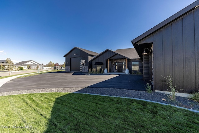 exterior space with a garage and an outbuilding