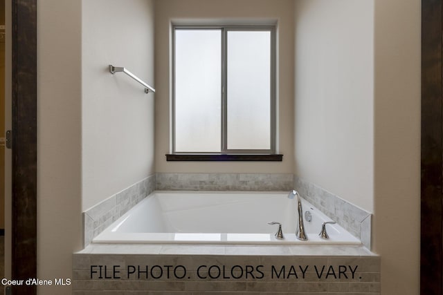 bathroom with a garden tub