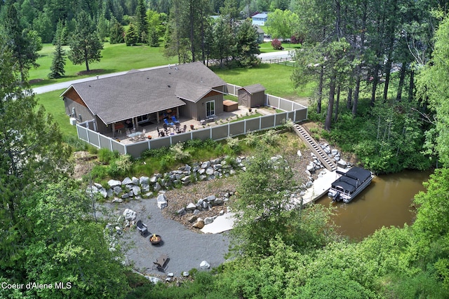 birds eye view of property with a water view